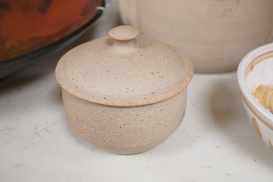 An Andrew Hill charger, 44cm diameter, two Mohammed Hamid (Lewes) bowls and two unsigned Bernard Leach pottery jars and covers